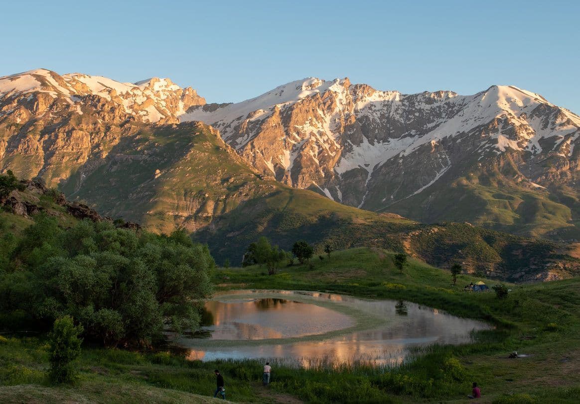 A pool below snow-streaked peaks in the Kurdistan Region