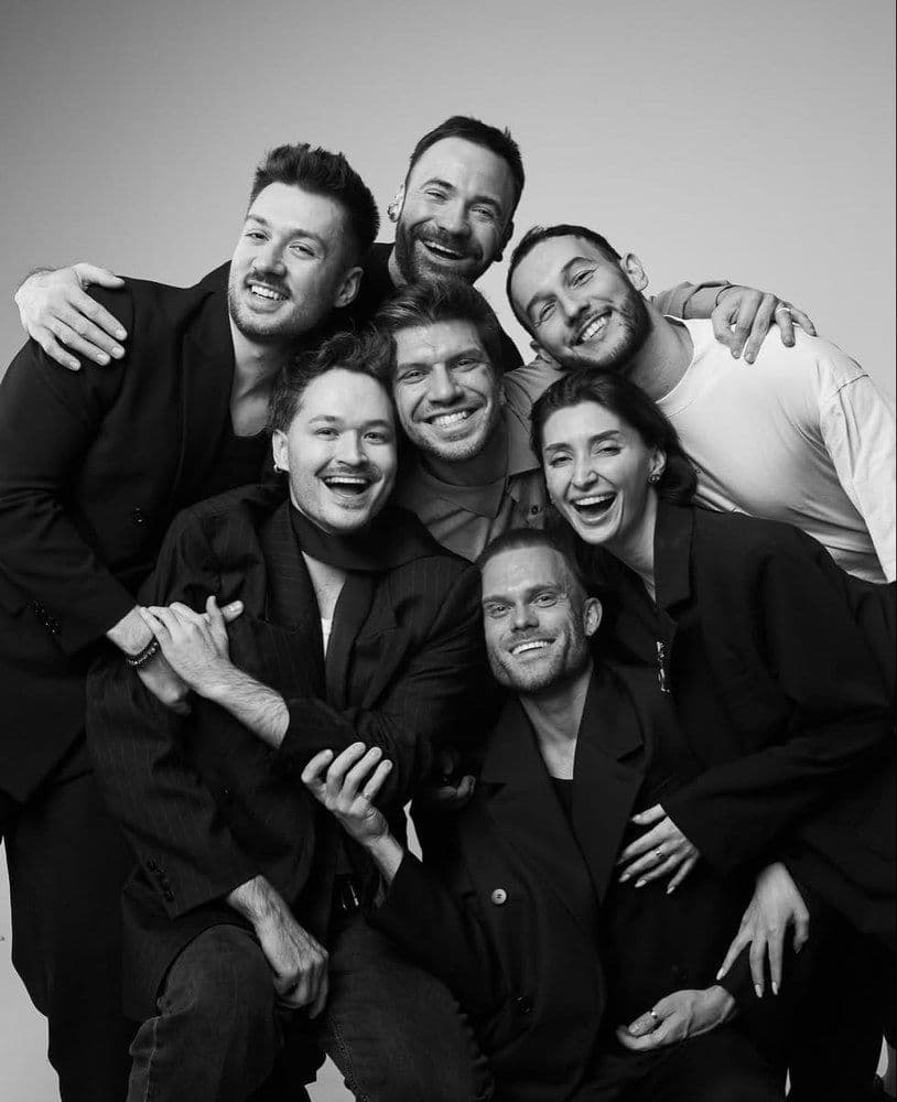 Agency crew leaning into frame for a group portrait