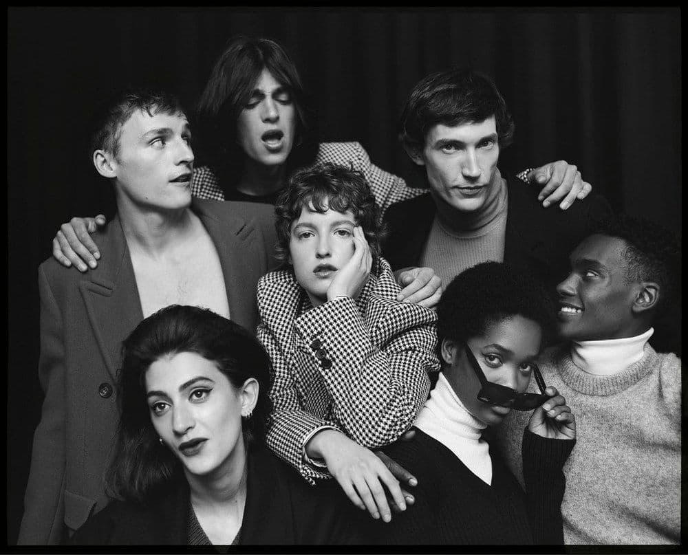 Black-and-white group portrait of an agency's crew