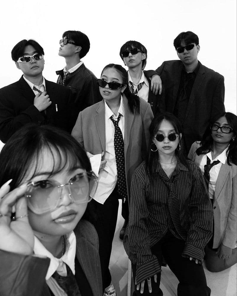 Agency team standing shoulder to shoulder in suiting