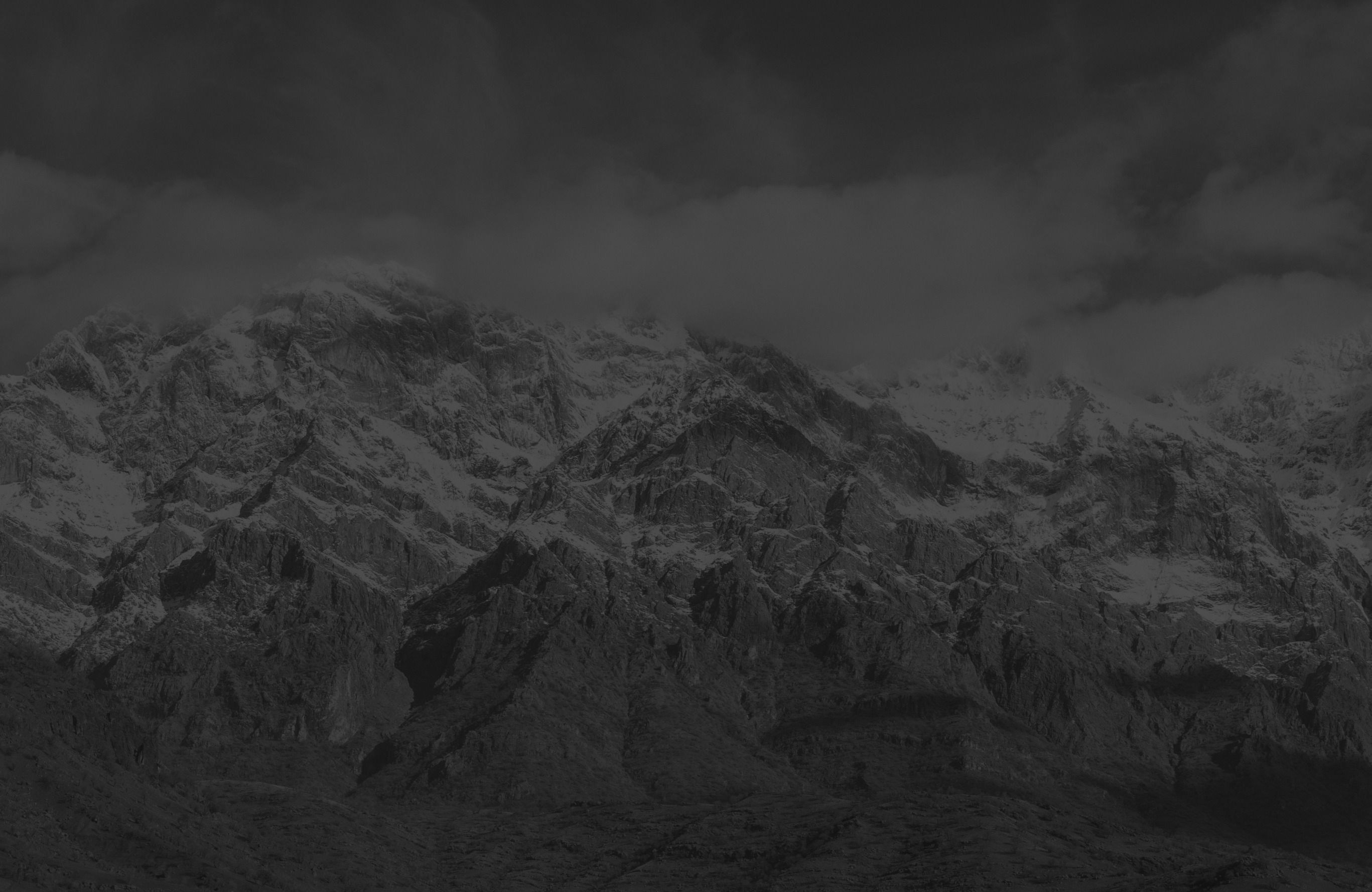 Cloud banking against snow-covered peaks above Slemani